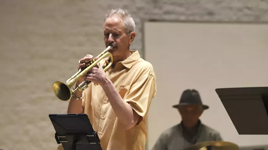 Under the direction of Scott Black, the band plays jazz standards from a variety of periods in big band style.
